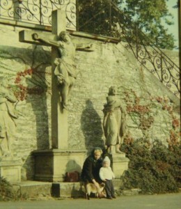 My Catholic mother wearing her then required headscarf, in 1966 Bütthard, Deutschland. I'm in the photo too, can you guess which one I am?